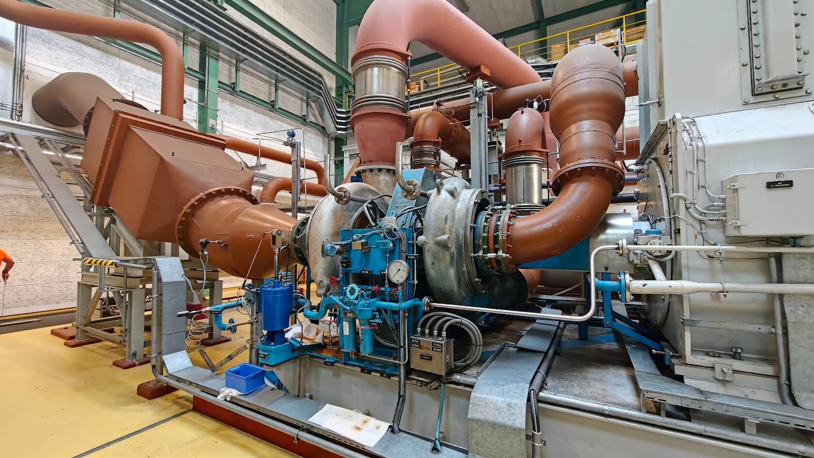 Engineer collecting vibration and temperature data on a running machine