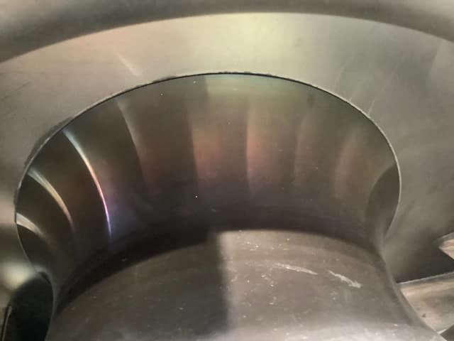 Overheated rotor shaft area showing tempering colours from friction