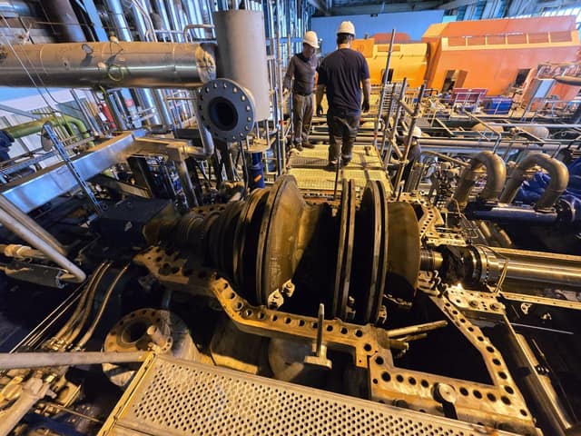 Field service engineer performing on-site turbine alignment