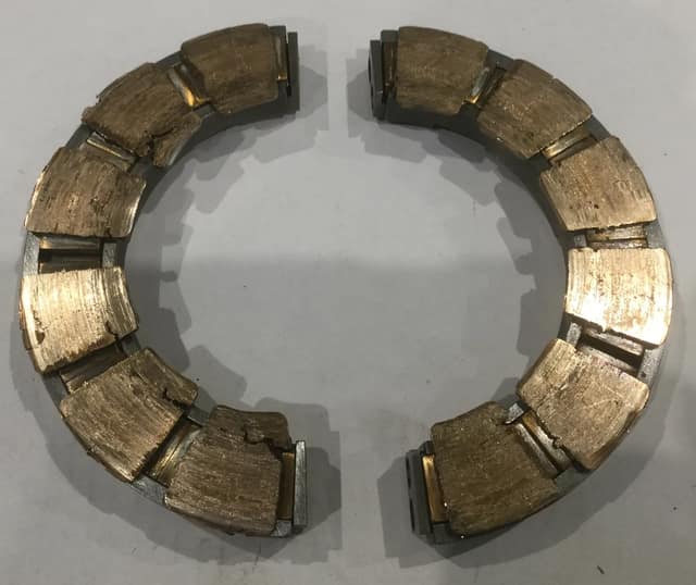 Axial thrust bearing pads with severely damaged white-metal surface