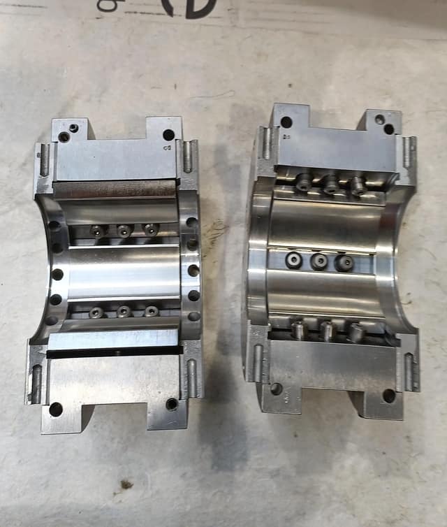 Machined tilting-pad bearing halves, reverse-engineered for the GX-420 rotor