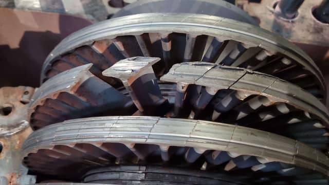 Broken rotor blades that detached from the second carrier during the incident