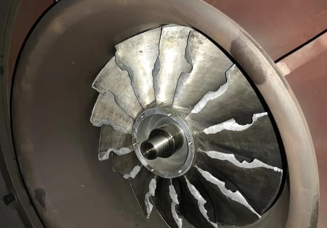 Fractured GX-420 impeller with blades torn along the shroud, root cause of the failure