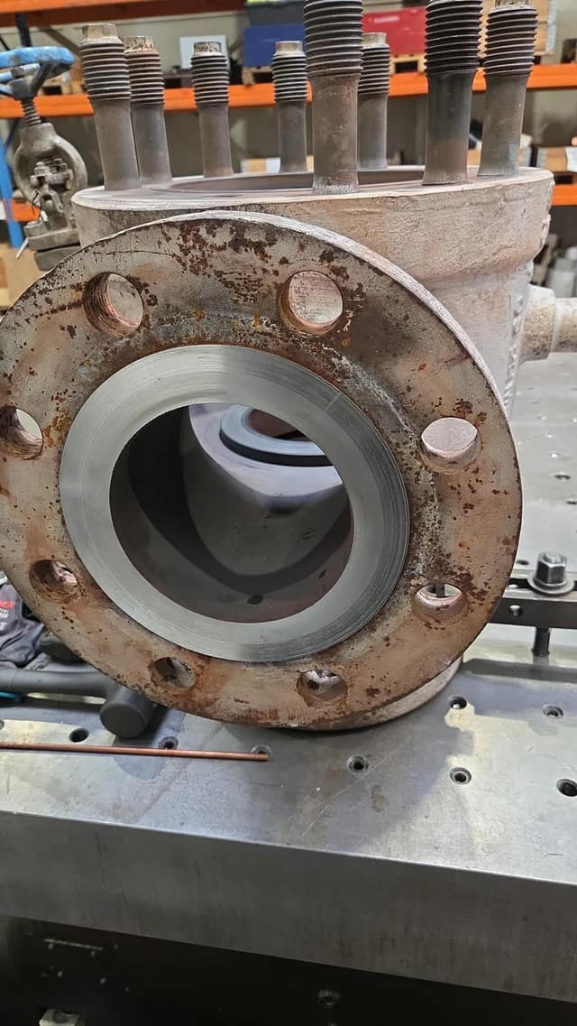 Valve flange machined back to a clean flat sealing face