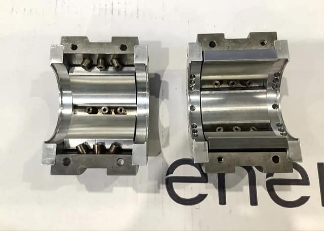 Two halves of a newly manufactured tilting pad bearing for the Atlas Copco GT063N4K1